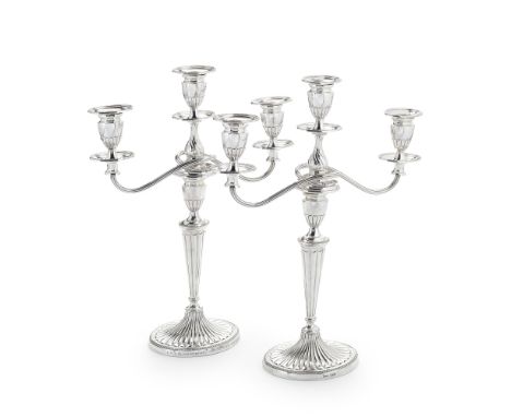 A pair of silver candlesticks with electroplated three-light branchesJenkins &amp; Timm, Sheffield 1894  Neo-classical in for