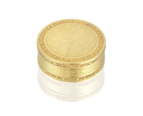 A Louis XVI vari-coloured gold circular snuff boxAuguste-Gaspard Turmine, Paris 1786 The cover with stellar engine-turning wi