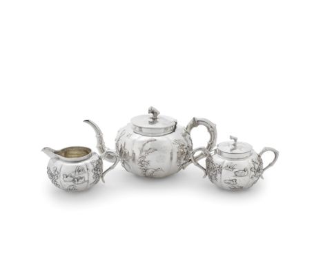 A Chinese Export silver three-piece tea serviceWang Hing, Hong Kong circa 1900, stamped WH, character mark and 90 Of compress