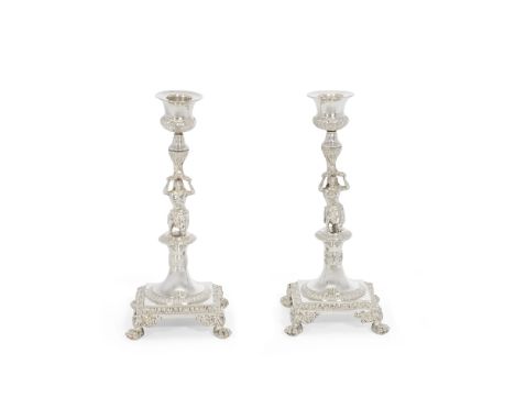 A pair of silver figural candlesticksmaker's mark rubbed, with French first standard mark for Paris 1819 - 1838Modelled as a 