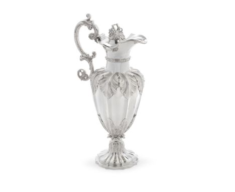 A Victorian silver ewerHenry Wilkinson &amp; Co, London 1867 Shaped-baluster form with lobed sides, with leafy shoulders, sti