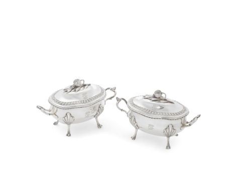A pair of George III silver sauce tureens and coversFrancis Crump, London 1771 Shaped-oval bellied form with undulating gadro