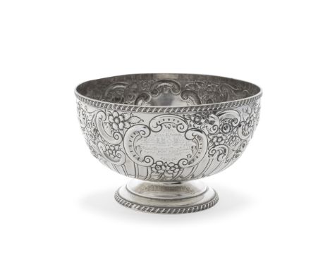 A Victorian silver bowlWilliam Hutton &amp; Sons Ltd,  London 1899profusely chased with foliate scrolls above a fluted lower 