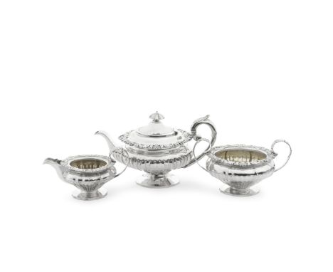 A George IV silver three-piece tea servicemaker's mark EB, probably Edward Barton, London 1822, 1825, 1834Shaped bellied form