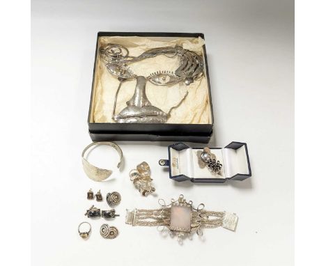 Three silver rings, a silver bangle and a silver bracelet, together with a white metal breast plate, a ring, a pair of earrin