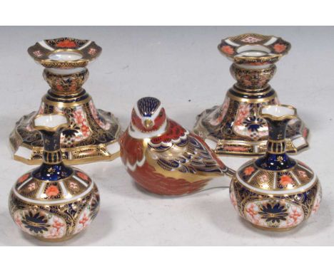 Royal Crown Derby - pair of small squat vases, pair of shaped candlesticks and a bird paperweight, tallest 8cm high (5)Some s