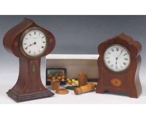 An Edwardian Art Nouveau style mahogany balloon-shaped mantle clock, 26cm high, and another, 20.5cm high; together with a sma
