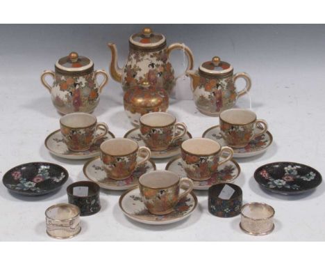 A Japanese earthenware pottery coffee service, for six people decorated with maidens and children in gardens comprising a tea