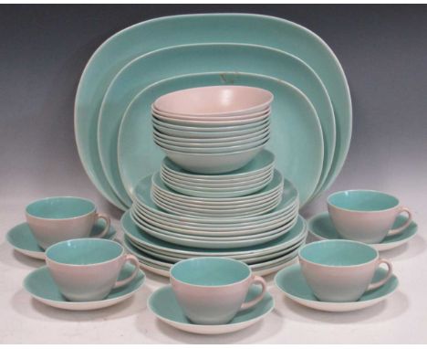 A Poole pottery C96 pattern part-tea service in blue and pink, including teacups, large platters, two terrine dishes and cove