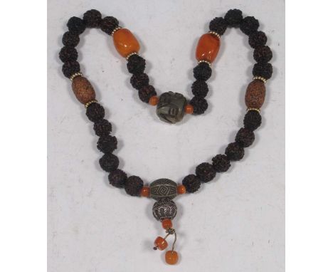 A string of Chinese beads including some amber, nut, peach and jade