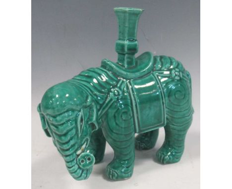 A Chinese turquoise glazed porcelain elephant joss stick holder, 19th/20th century, 14.5cm highScratches and markings on the 