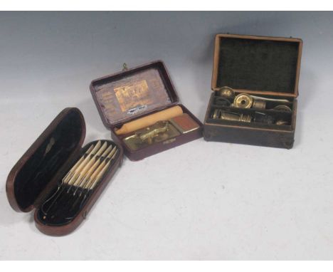 A pocket-size brass and bone microscope with some specimen slides (part); together with a 'Crab' Railway Reading Lamp in a re