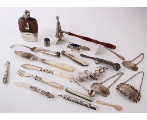 A quantity of silver, three drinks labels, pin cushions, babies rattle, fruit and fish knives/forks,mother of pearl pen knive