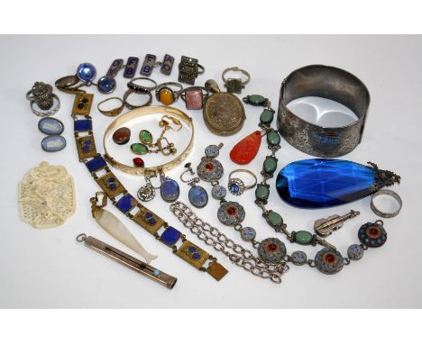 A Mexican silver bracelet and green stone bracelet, a silver engraved bangle, a silver violin charm and other assorted costum