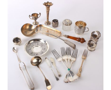 Silver and silver plate: An Indian silver metal teacup, saucer and sugar bowl, napkin rings, ladle, crumb scoop, small trophy