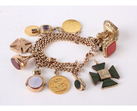 A 9ct gold charm bracelet with assorted gold and coloured charms; fobs, a compass, a half sovereign,a full sovereign, a Georg