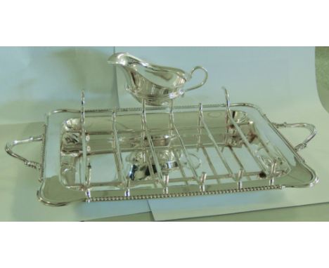 A silver asparagus tray, jug and another item, Maple & Co. Sheffield, 1930, 33.4 troy oz in total
