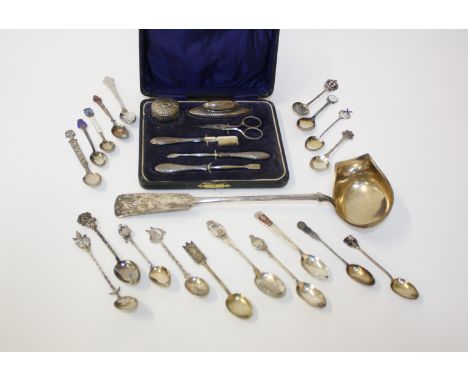 A silver mounted boxed manicure set, Sanders & Mackenzie, Birmingham, 1937, silver plate ladle and a collection of silver and