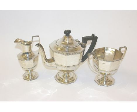 A silver three piece octagonal tea service by Martin Hall & Co Ltd Sheffield 1919. 46 toz or 1460.8 grams