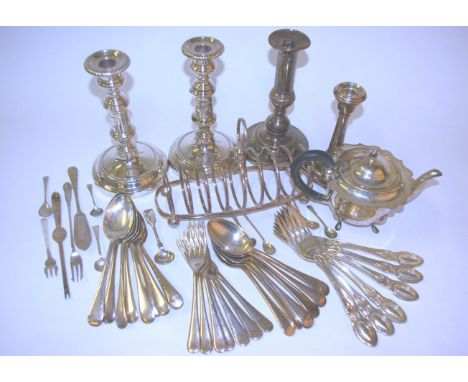 Silver plate table ware, including a pair of candle sticks, loose flatware, tea pot , toast rack, ladle etc.  