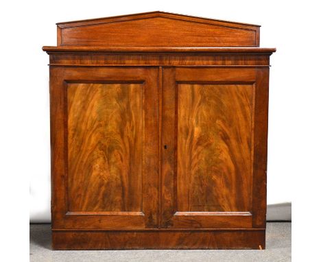 George IV mahogany cupboard, architectural back, two panelled doors, plinth base, width 116cm, depth 55cm, height 127cm.