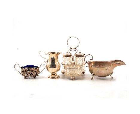 A silver sauce boat, Charles S Green &amp; Co, Birmingham 1941, on three raised hoof feet; a Victorian silver cream jug; an o