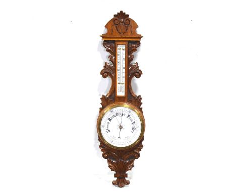 Oak aneroid barometer, carved case, 90cm.Condition report:There is a small loss of wood to the top left, behind the cornice. 