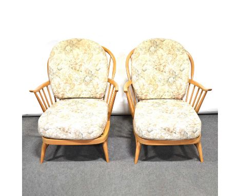 Pair of Ercol easy chairs, light beech spindle frames, loose cushions.Qty: 2