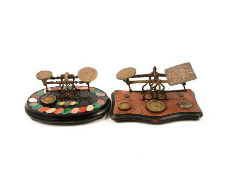 Set of Victorian postal scales. engraved brass mounts on a specimen marble base, 24cm, and a brass and walnut set.Qty: 2Condi