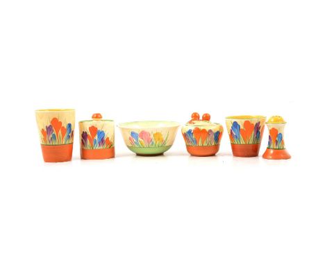 Clarice Cliff, a small quantity of 'Crocus' pattern breakfast ware including a cylindrical preserve pot and cover, another pr
