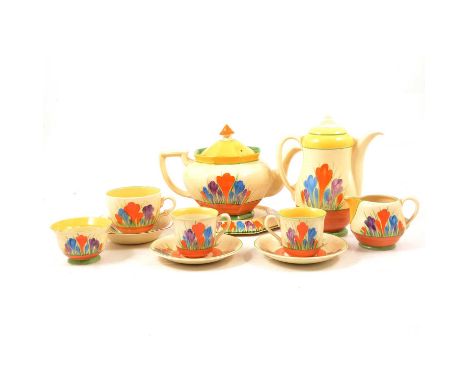 Clarice Cliff, a collection of 'Crocus' pattern tea ware, including an Athens shape teapot, octagonal stand, coffee pot, smal