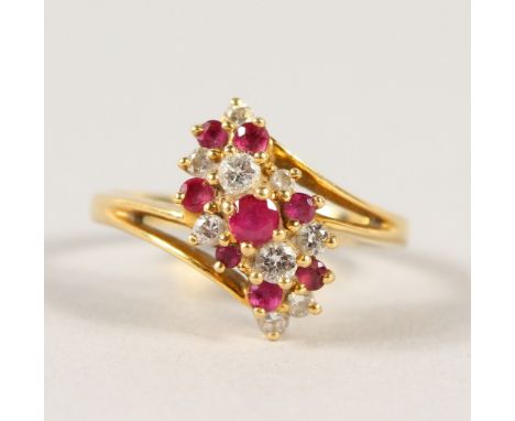 AN 18CT GOLD, DIAMOND AND RUBY RING.