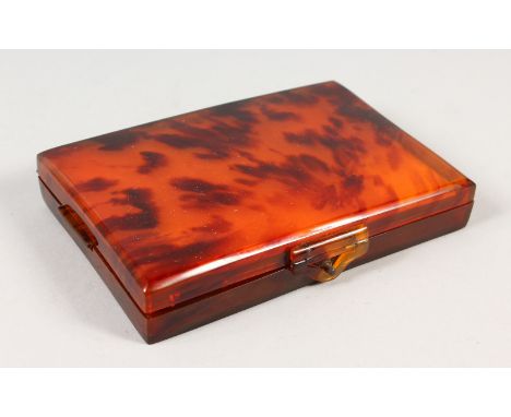 AN ART DECO TORTOISESHELL COMPACT.