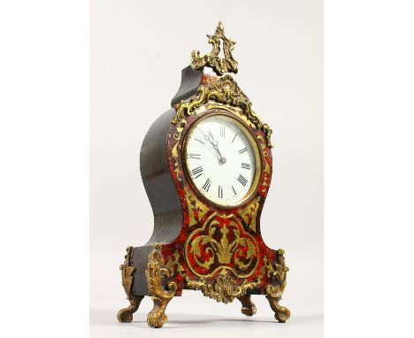 A SMALL FRENCH BOULLE MANTLE CLOCK with brass inlay. 28cms high.