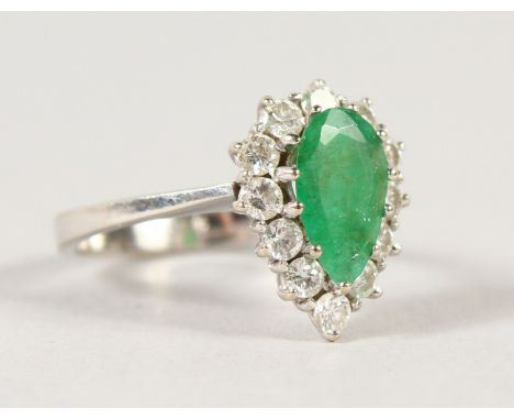 A GOOD 18CT GOLD, EMERALD AND DIAMOND TEARDROP RING.