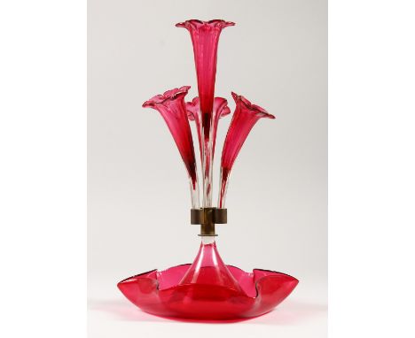 A VICTORIAN RUBY GLASS CENTREPIECE with four trumpets. 36cms high.