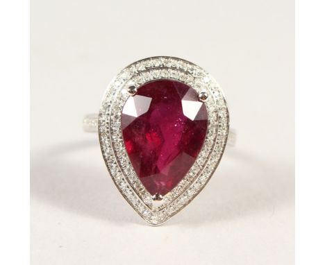 A 14K WHITE GOLD AND DIAMOND RING, set with a pear cut ruby approx. 7.43ct, diamonds approx. 0.60ct total weight.