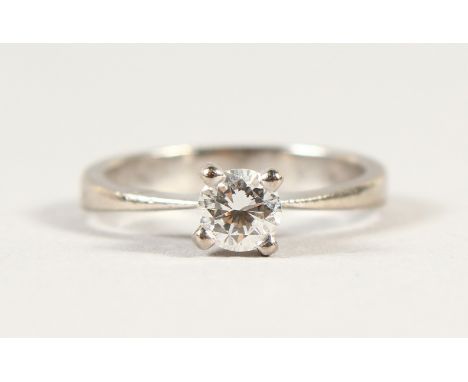 AN 18CT GOLD SOLITAIRE DIAMOND RING.