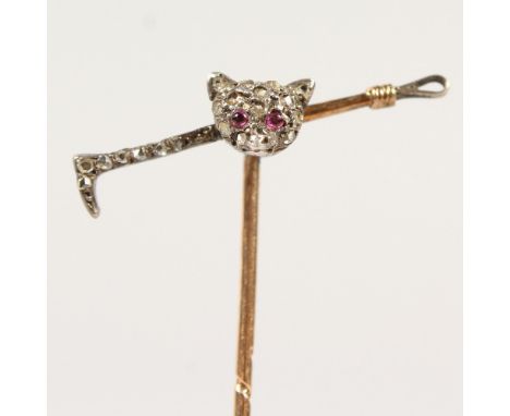 A DIAMOND SET TIE PIN, FOX HEAD and STICK. Provenance: W. Wood, Nottingham.