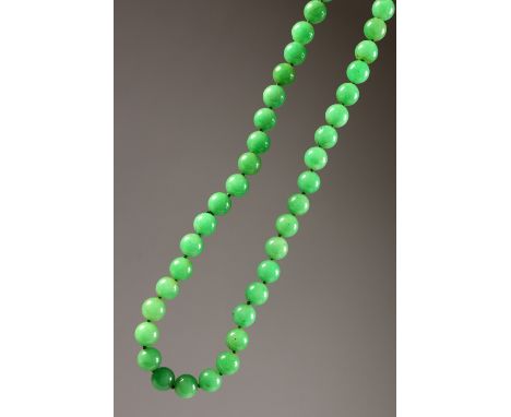 A CHINESE JADE BEAD NECKLACE. 80cms long.