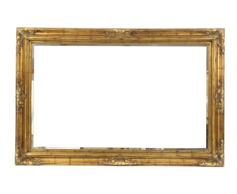 A gilt framed wall mirror,the rectangular plate within a moulded frame with embellished foliate decoration,178 x 117cmConditi