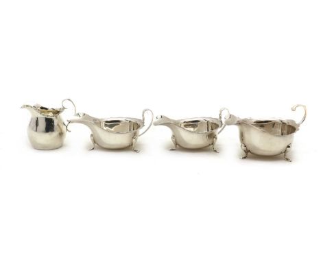 A group of three silver sauceboats,comprising a pair by Viner's Ltd, Sheffield 1935 and London 1934, the third by Adie Brothe