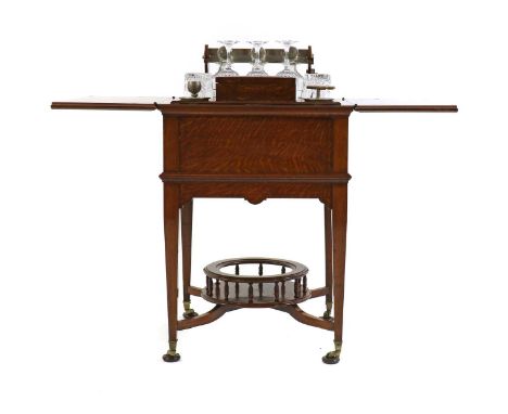 An Edwardian oak drinks table,early 20th century, by Albert Barker of New Bonds Street, the square top with hinges opening to