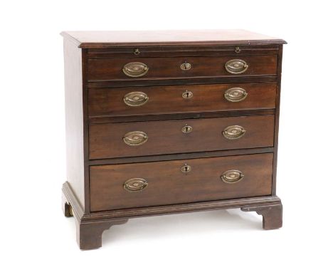 A small George III mahogany chest of drawers,with brushing slide, four long drawers, oval brass handles, on bracket feet81cm 