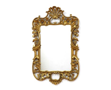 A Rococo style gilt mirror,early 20th century, decorated with fruit and 'C' scrolls,67cm wide108cm highCondition ReportWear a