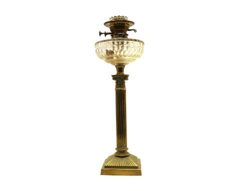 A Corinthian column oil lantern, the clear-cut glass reservoir of dome form on column support and fluted square section base 