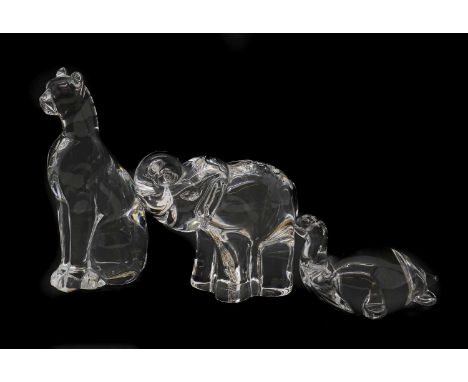 A Baccarat glass figure of a cat,acid marked,15.7cm high,together with a Steuben glass figure of an elephant,engraved signatu