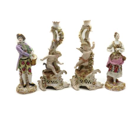 A pair of Sitzendorf porcelain candlesticks,late 19th early 20th century, the gilt heighted stems modelled with cherubs raise