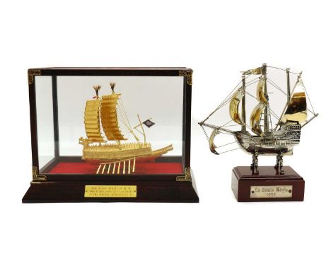 A gilt metal model of a Geobukseon or Korean turtle boat,the case with a plaque engraved 'The The First Armour Clad Ship in t
