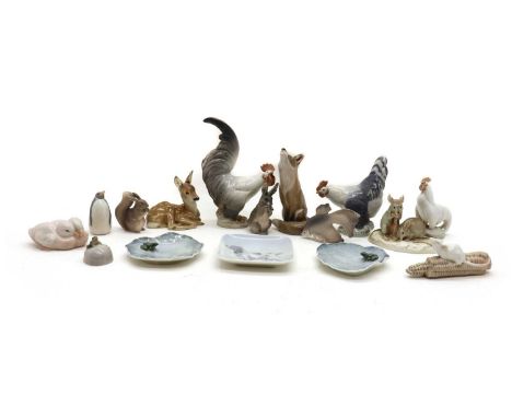 A collection of Royal Copenhagen porcelain figures;comprising a cockerel, hen, bantam, fox, rabbit, squirrel, penguin, ducks,